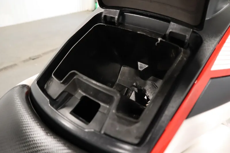 Slide: The Image of Open storage compartment of 2018 Yamaha GP1800 jet ski, showcasing interior details. - 18