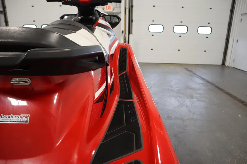 Slide: The Image of Red 2018 Yamaha GP1800 jet ski in a garage, showcasing sleek design and detailing. - 20