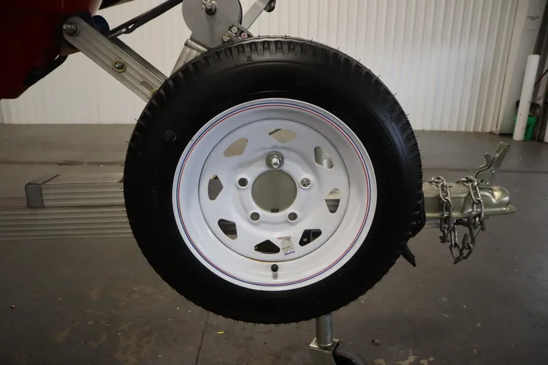 Slide: The Image of Trailer wheel for 2018 Yamaha GP1800, featuring white rim and attached chains. - 26