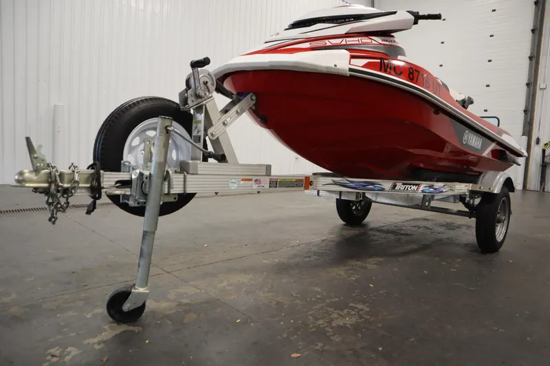 Slide: The Image of 2018 Yamaha GP1800 jet ski on trailer in indoor setting. - 27