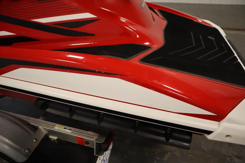 Slide: The Image of 2018 Yamaha GP1800 jet ski, red and white design, on a trailer. - 29
