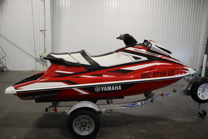 Slide: The Image of 2018 Yamaha GP1800 WaveRunner in red and white on a trailer, indoor setting. - 4