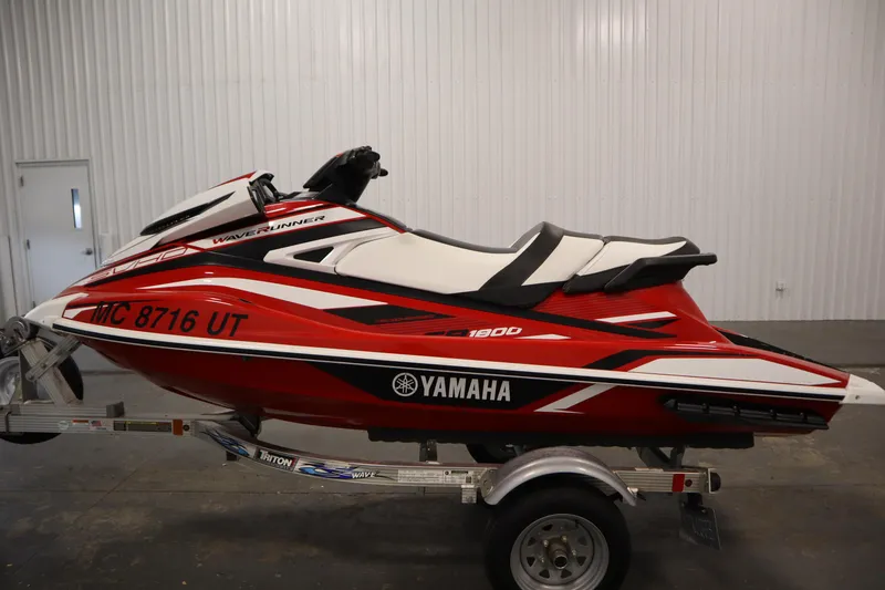 Slide: The Image of 2018 Yamaha GP1800 WaveRunner in red and white on a trailer, indoor setting. - 8