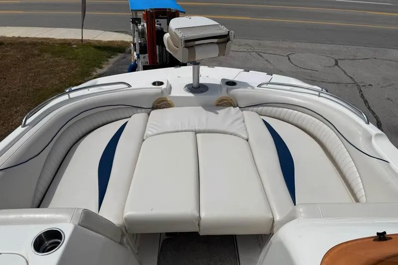 Slide: The Image of 2006 Hurricane GS194 Fundeck boat interior with white seating and blue accents. - 10