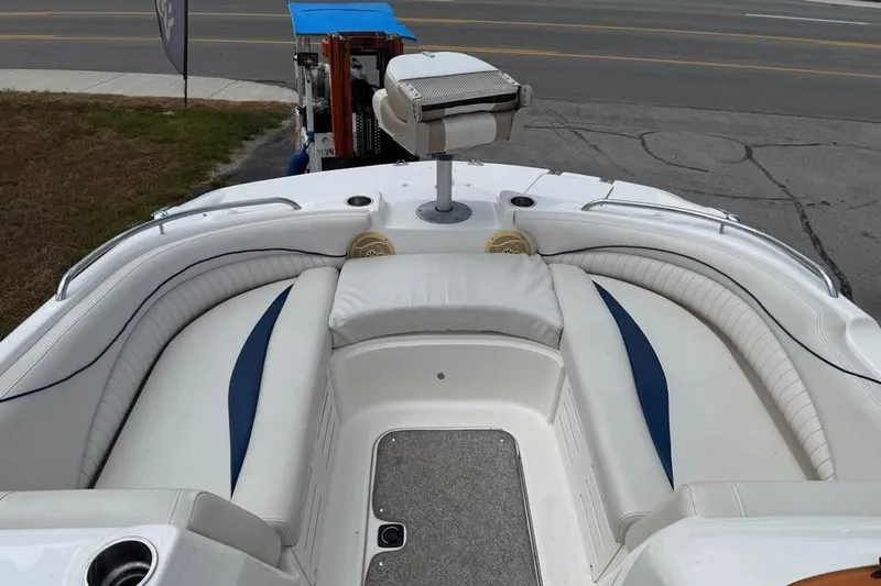 Slide: The Image of 2006 Hurricane GS194 Fundeck boat interior with white seating and blue accents. - 11