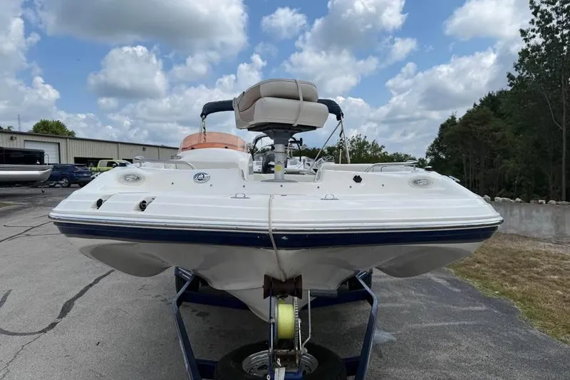 Slide: The Image of 2006 Hurricane GS194 Fundeck boat on trailer under a partly cloudy sky. - 2