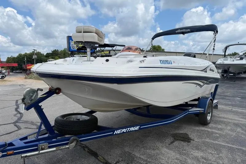 Slide: The Image of 2006 Hurricane GS194 Fundeck boat on trailer under cloudy sky. - 3