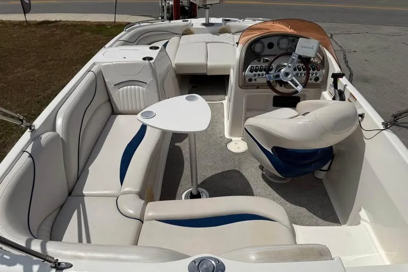 Slide: The Image of 2006 Hurricane GS194 Fundeck boat interior with seating, table, and steering console. - 6