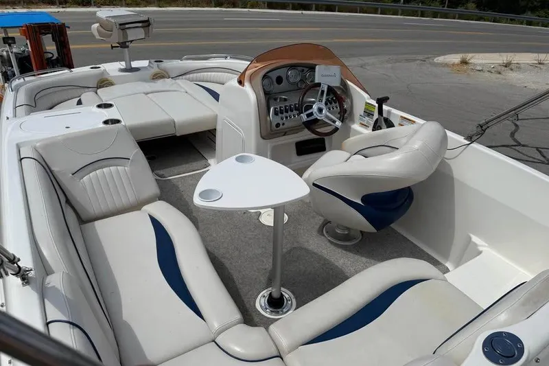 Slide: The Image of 2006 Hurricane GS194 Fundeck boat interior with seating, steering console, and table. - 7