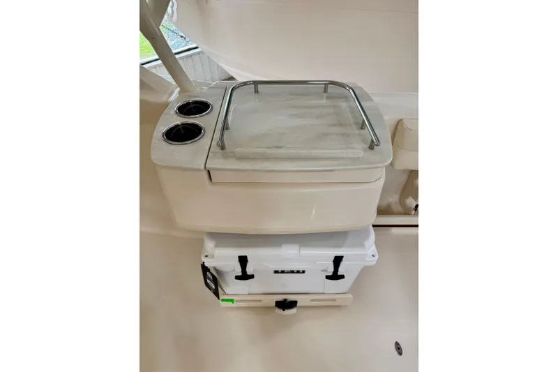 Slide: The Image of Grady-White Freedom 235 boat interior with cooler and cup holders, 2026 model. - 4