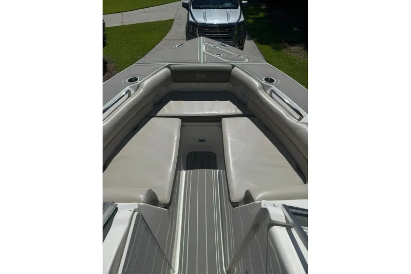 Slide: The Image of 2021 Key West 239 DFS boat interior with cushioned seating and cup holders. - 11