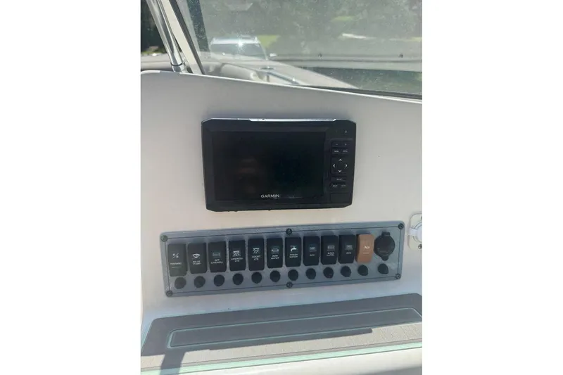 Slide: The Image of 2021 Key West 239 DFS dashboard with Garmin display and control panel. - 14