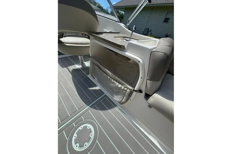 Slide: The Image of 2021 Key West 239 DFS boat interior with seating and storage compartment. - 19
