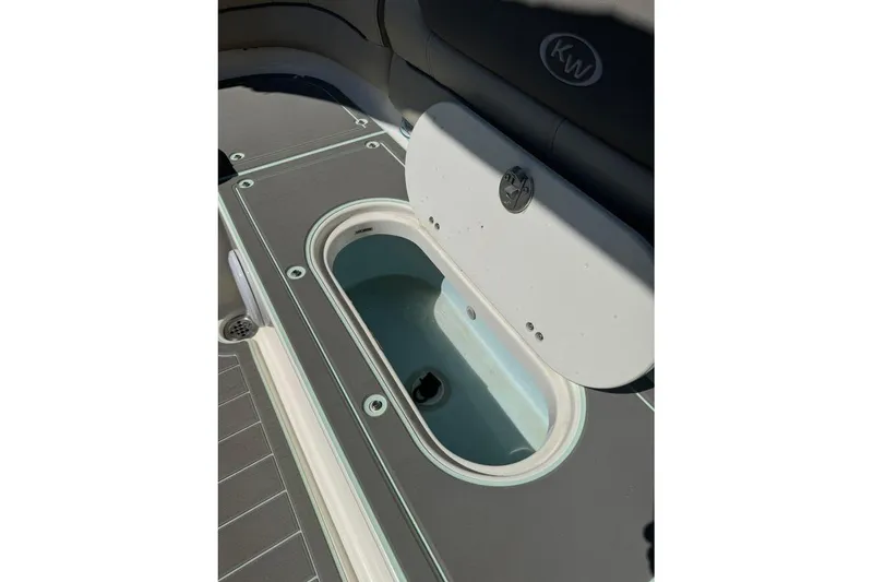Slide: The Image of 2021 Key West 239 DFS boat interior with open storage compartment. - 21