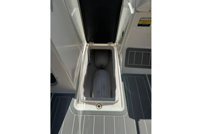 Slide: The Image of Open storage compartment on 2021 Key West 239 DFS boat deck. - 23
