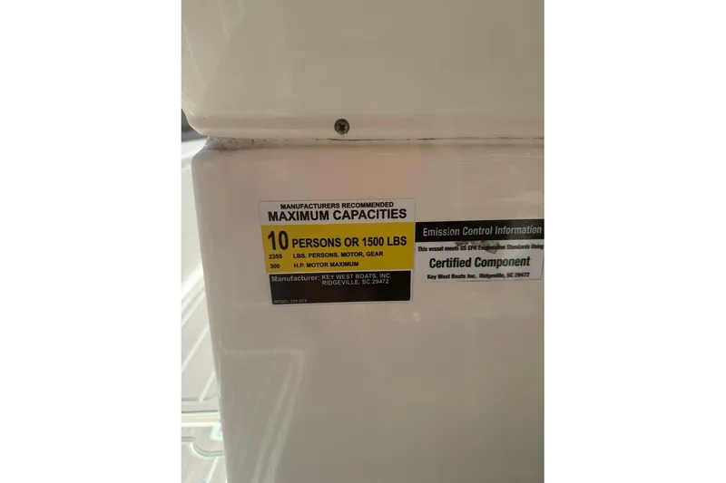 Slide: The Image of Key West 239 DFS 2021 boat capacity label, 10 persons or 1500 lbs, certified component. - 26