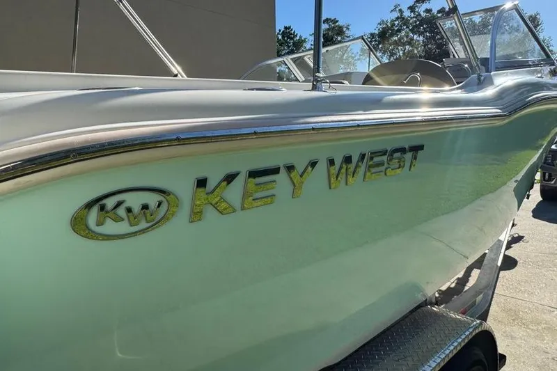 Slide: The Image of 2021 Key West 239 DFS boat side view with logo in sunlight. - 6
