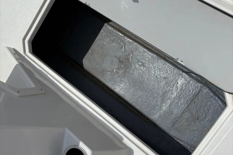 Slide: The Image of Open storage compartment on 2021 Starcraft SVX 171 OB boat. - 10