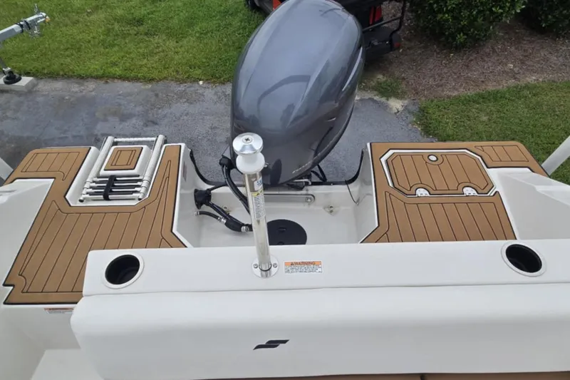 Slide: The Image of 2021 Starcraft SVX 171 OB boat with outboard motor and teak-style deck. - 12