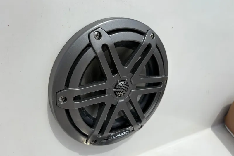 Slide: The Image of JL Audio speaker on 2021 Starcraft SVX 171 OB boat, mounted on white surface. - 16
