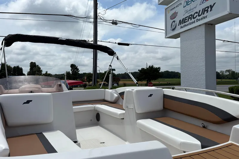 Slide: The Image of 2021 Starcraft SVX 171 OB boat interior with seating, displayed at a Mercury dealer. - 6