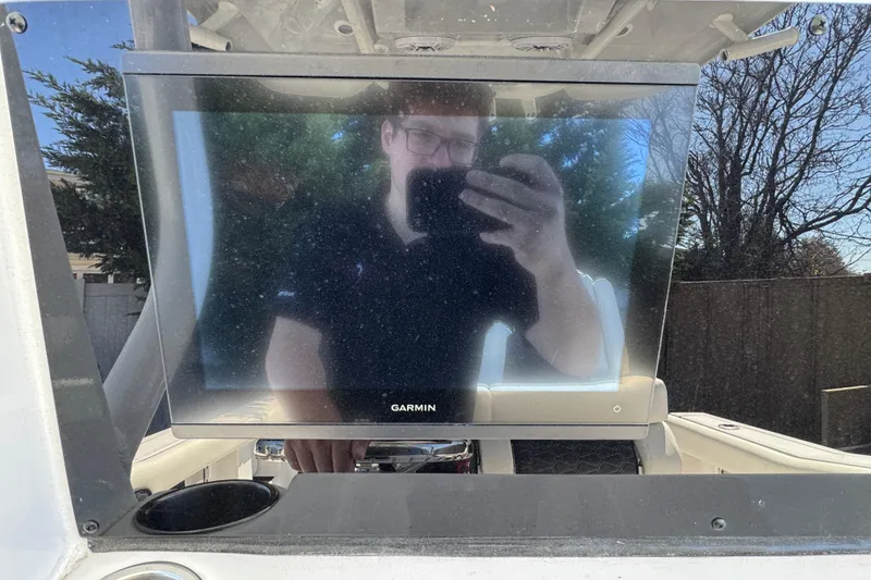 Slide: The Image of Reflection on Garmin screen aboard 2025 Tidewater 282 CC Adventure boat. - 14