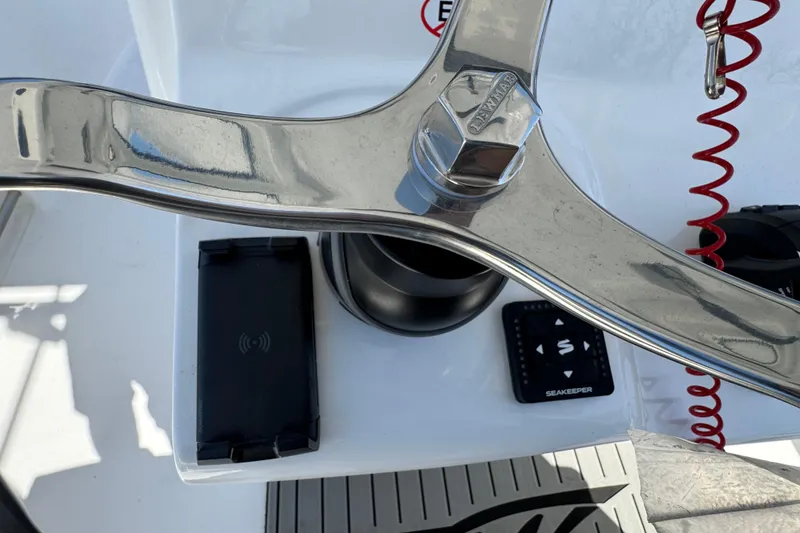 Slide: The Image of Steering wheel and controls of 2025 Tidewater 282 CC Adventure boat. - 19