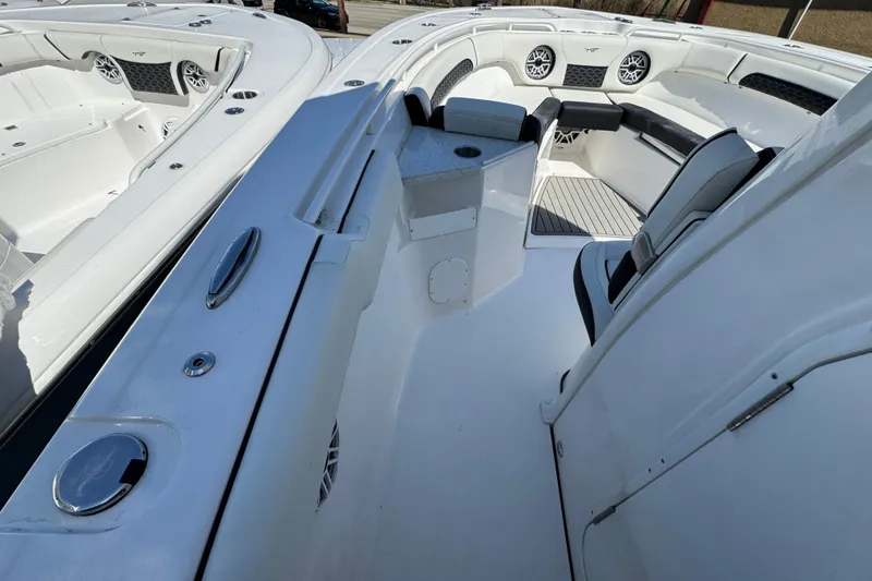 Slide: The Image of 2025 Tidewater 282 CC Adventure boat interior with seating and speakers. - 24