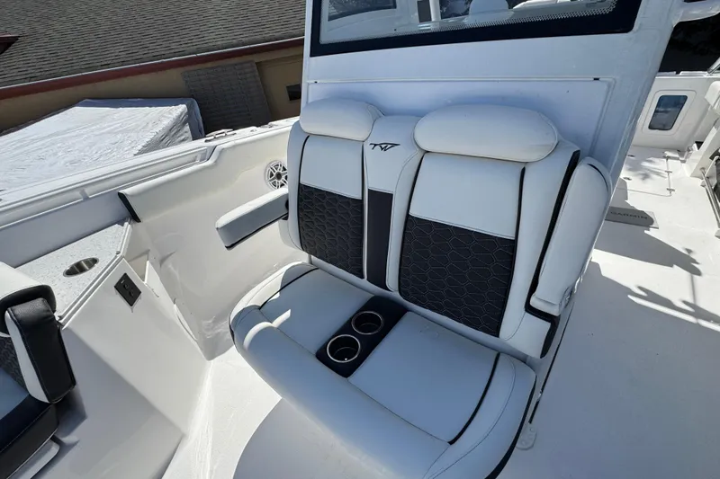 Slide: The Image of 2025 Tidewater 282 CC Adventure boat seating with cup holders and stylish upholstery. - 25