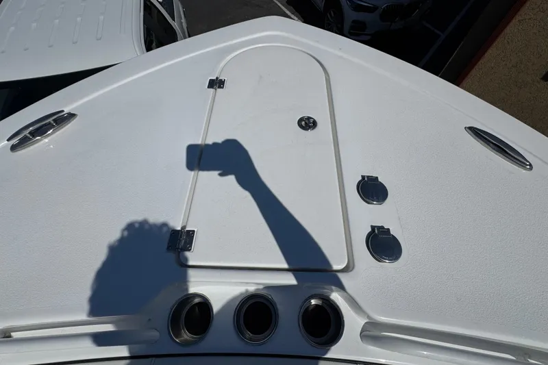 Slide: The Image of 2025 Tidewater 282 CC Adventure boat deck with storage hatch and fittings. - 29