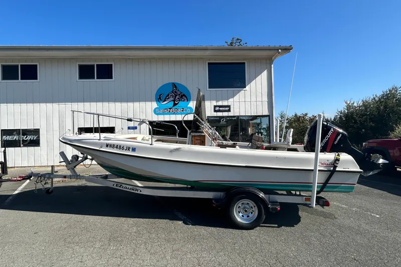 Slide: The Image of 1977 Boston Whaler 19 OUTRAGE boat on trailer outside Salish Boat Co. - 0