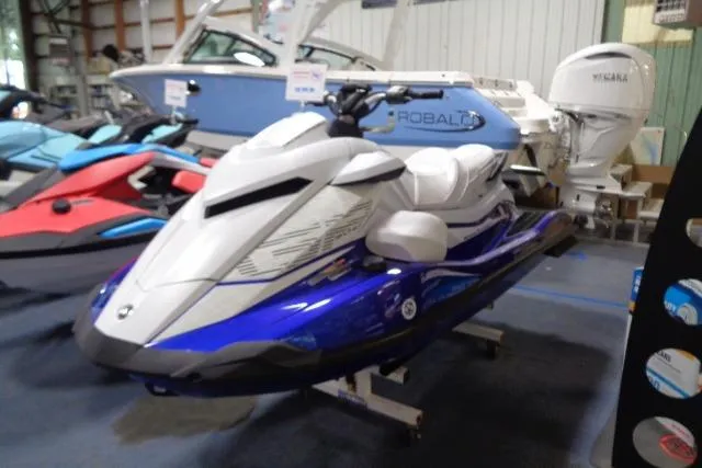The Image of 2025 Yamaha WaveRunner GP1800R SVHO in showroom, blue and white design. - 15