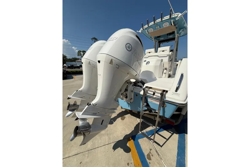Slide: The Image of 2016 Everglades 255 Center Console boat with dual Yamaha outboard engines. - 13