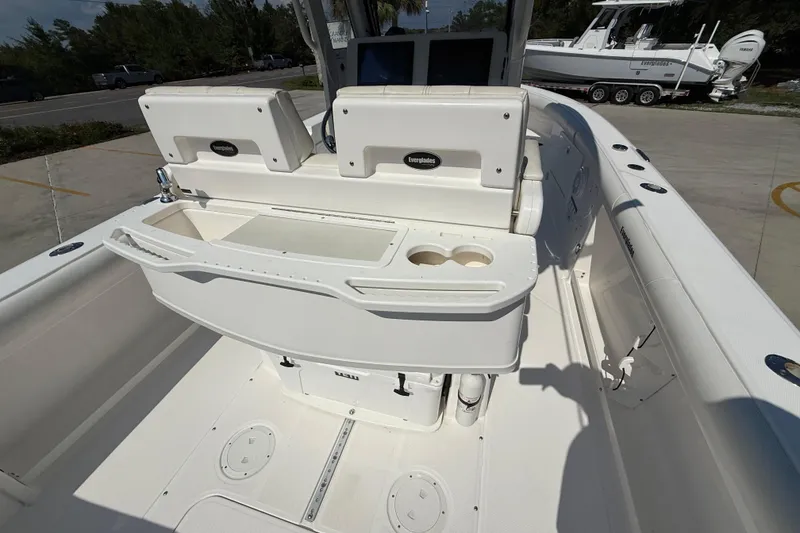 Slide: The Image of 2016 Everglades 255 Center Console boat interior with seating and storage compartments. - 7
