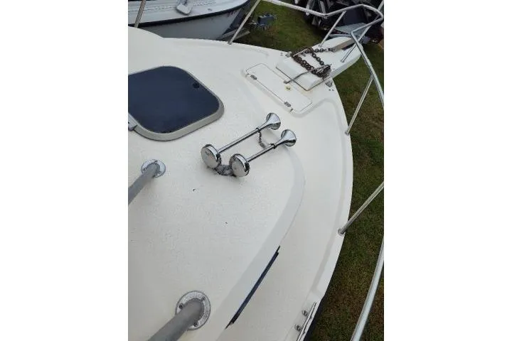 Slide: The Image of 1996 Parker 2110 Walkaround boat deck with railing and hatch, viewed from above. - 14