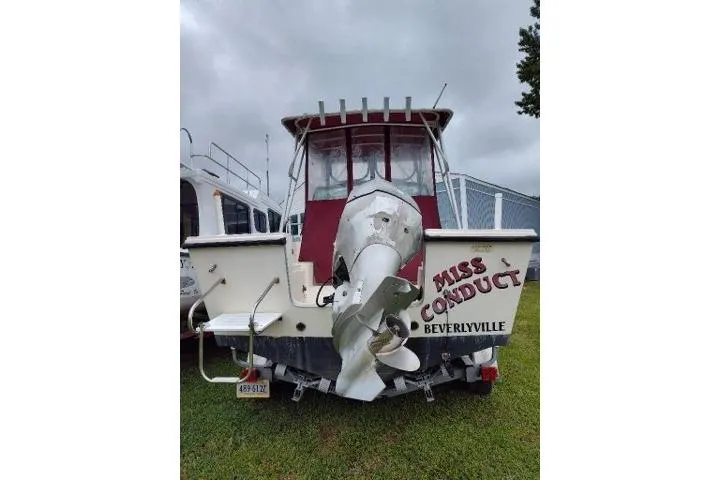 Slide: The Image of 1996 Parker 2110 Walkaround boat named "Miss Conduct" in Beverleyville, rear view. - 3