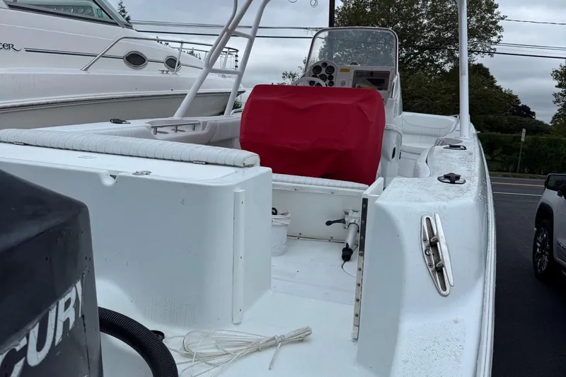Slide: The Image of 2000 Baja 340 Sport Fisherman boat with red-covered console, docked outdoors. - 1