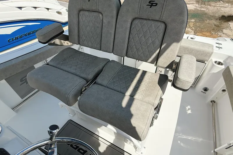 Slide: The Image of 2023 Sea Pro 239 DLX boat seats with gray upholstery and diamond stitching. - 15