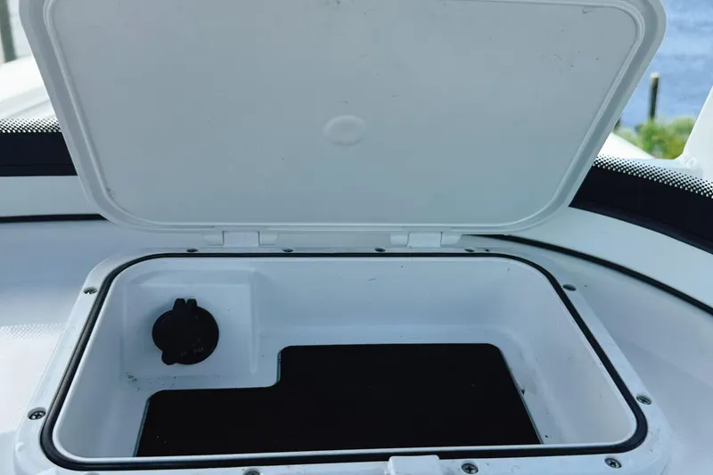 Slide: The Image of Open storage compartment on 2023 Sea Pro 239 DLX boat. - 20