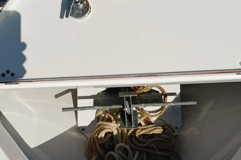 Slide: The Image of 2023 Sea Pro 239 DLX boat anchor compartment with coiled rope. - 27
