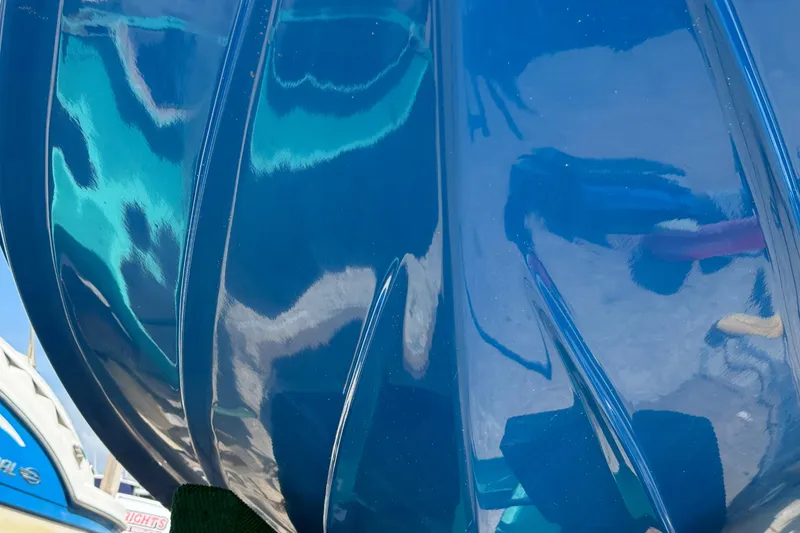 Slide: The Image of Close-up of 2023 Sea Pro 239 DLX boat hull with glossy blue finish. - 8