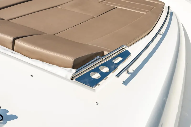 Slide: The Image of Luxurious sunbed on 2014 Prestige Yachts 550 Flybridge, featuring sleek design and comfortable cushions. - 15