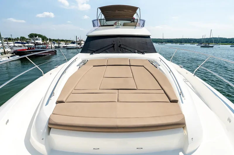 Slide: The Image of 2014 Prestige Yachts 550 Flybridge with sunbathing deck, docked in a marina. - 18