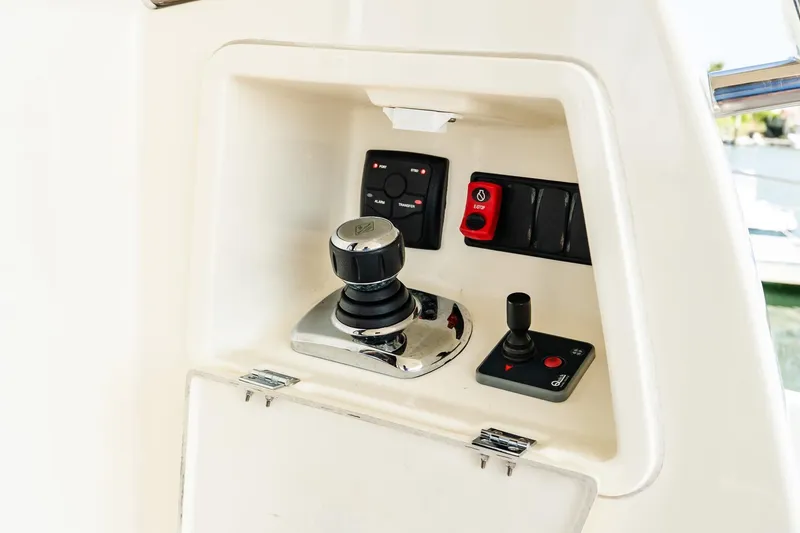 Slide: The Image of Control panel of 2014 Prestige Yachts 550 Flybridge with joystick and buttons. - 20