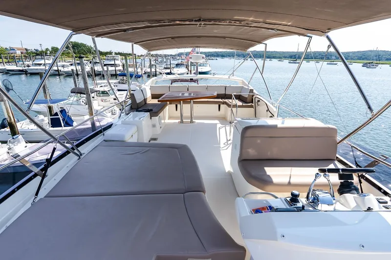 Slide: The Image of 2014 Prestige Yachts 550 Flybridge, spacious deck view at marina. - 22