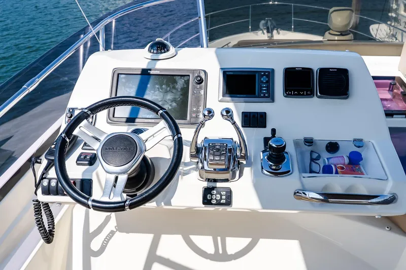 Slide: The Image of Flybridge helm of 2014 Prestige Yachts 550, featuring advanced navigation controls. - 25