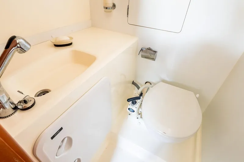 Slide: The Image of Bathroom interior of 2014 Prestige Yachts 550 Flybridge with sink and toilet. - 27