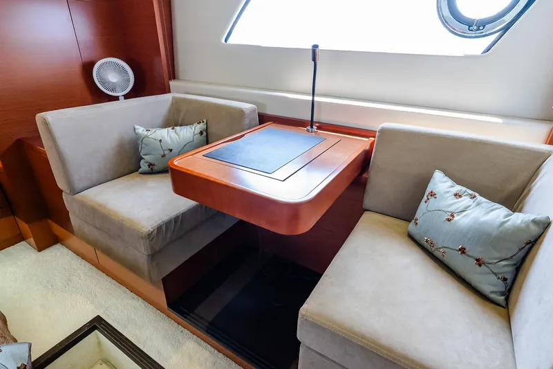 Slide: The Image of Luxurious seating area on 2014 Prestige Yachts 550 Flybridge with elegant cushions and table. - 30