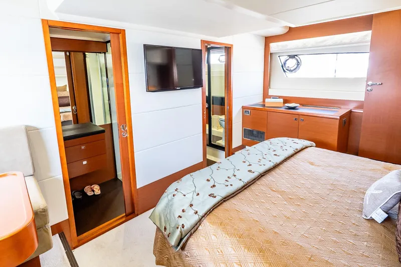 Slide: The Image of Luxurious bedroom interior of 2014 Prestige Yachts 550 Flybridge with modern amenities. - 31