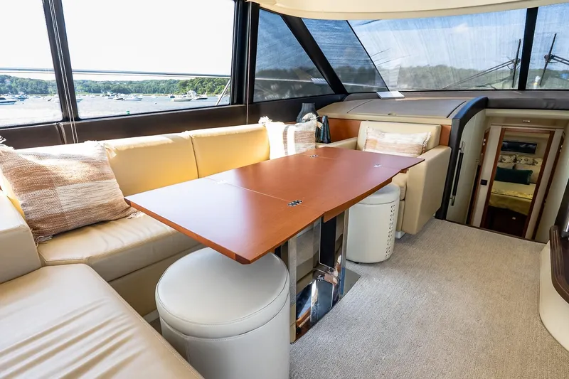 Slide: The Image of Luxurious interior of 2014 Prestige Yachts 550 Flybridge with elegant seating and table. - 42